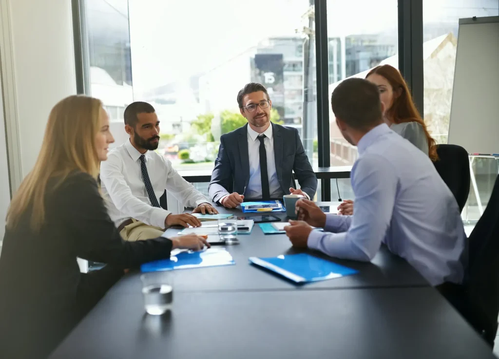 Financial, investor or business people in meeting