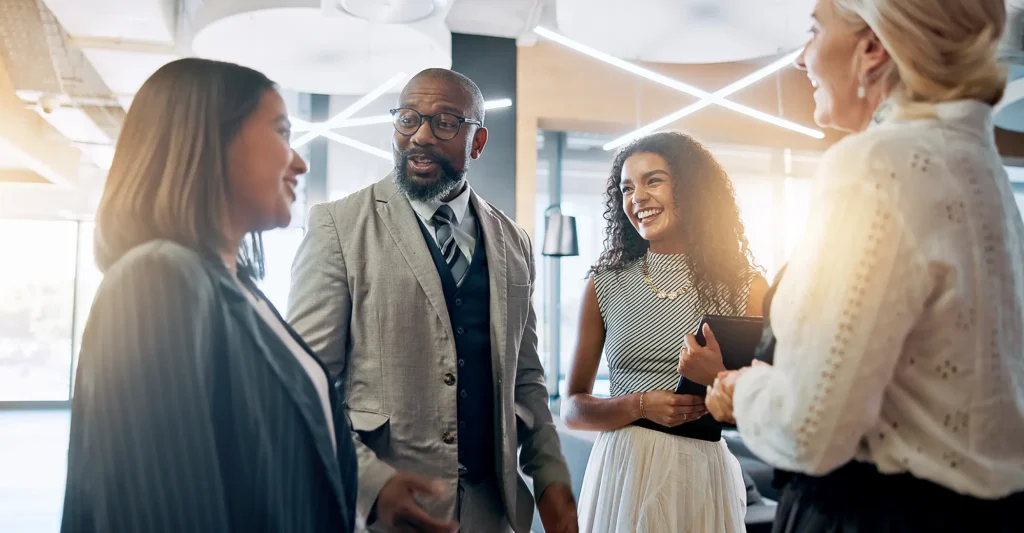 Discussion, smile and business people in lobby for teamwork