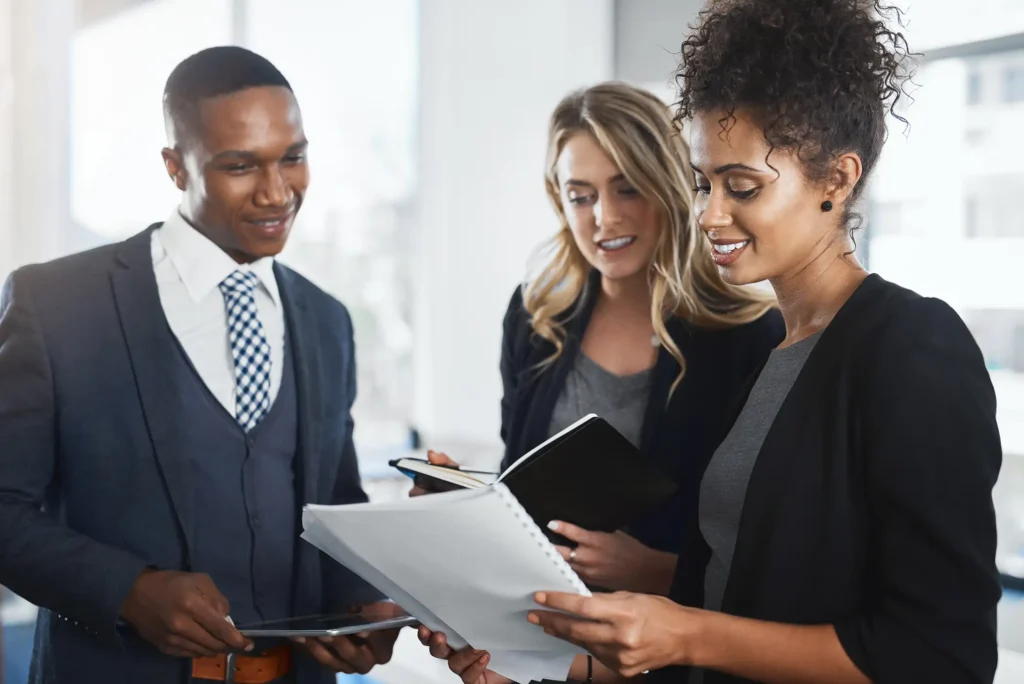 Discussion, teamwork and documents with business people in office