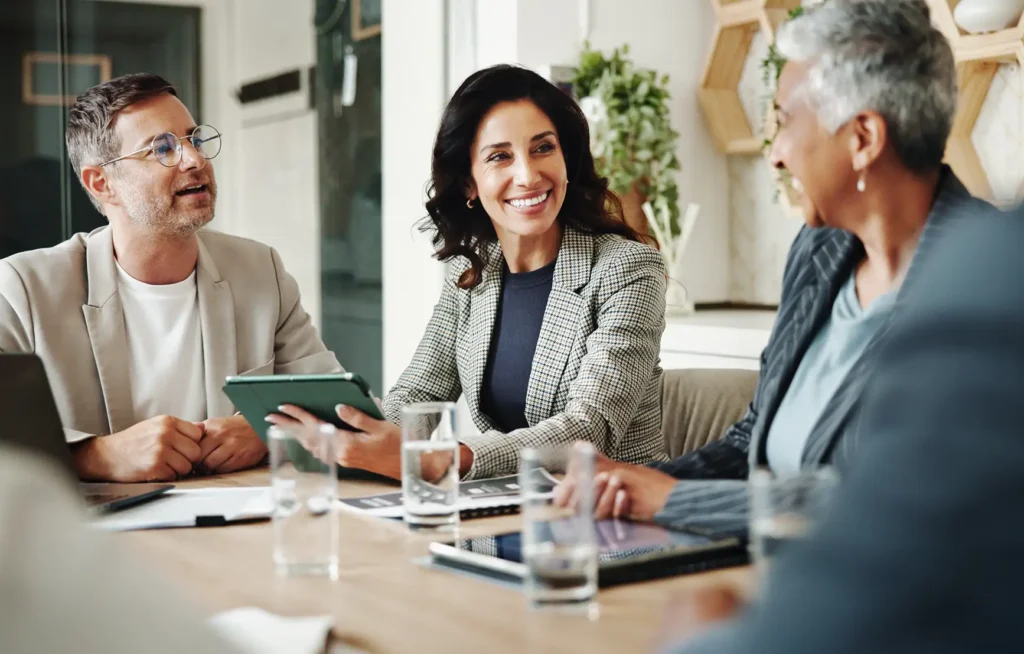 Tablet, corporate and business people in meeting with manager for feedback