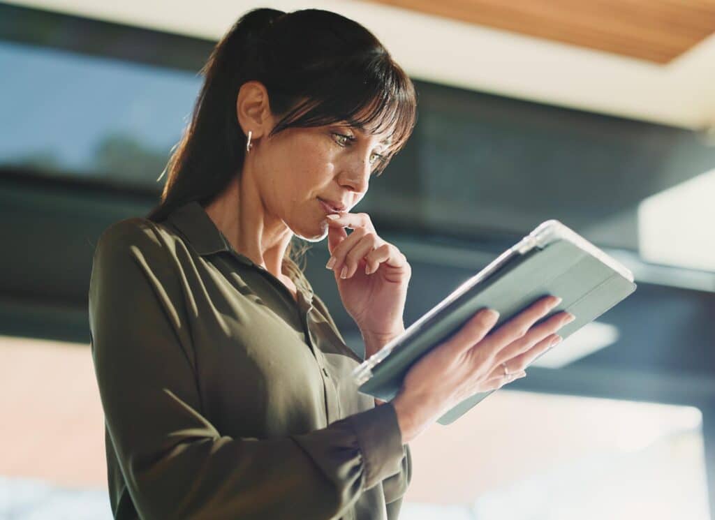 Thinking, business and woman with tablet